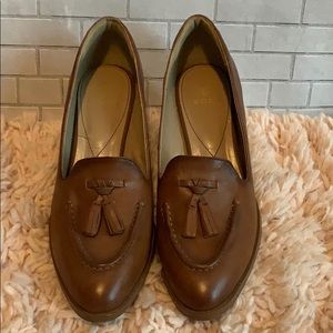 Beautiful Brown Isola tassel heeled loafers.